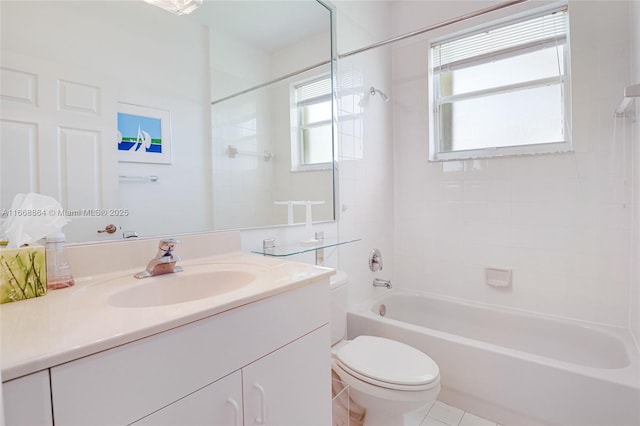 full bathroom featuring tiled shower / bath, vanity, and toilet