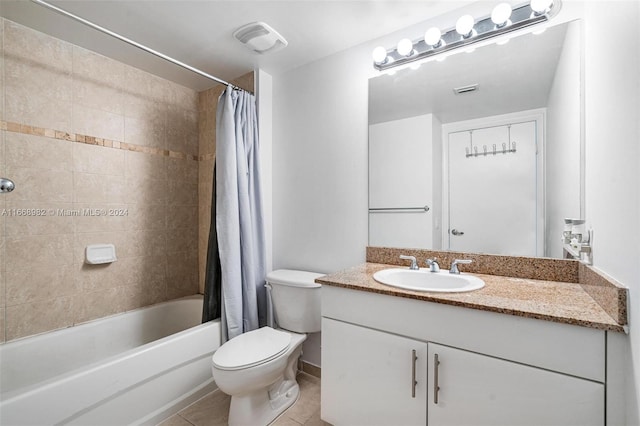 full bathroom with shower / bath combination with curtain, vanity, tile patterned flooring, and toilet