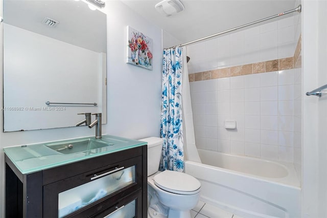 full bathroom featuring shower / tub combo, vanity, toilet, and tile patterned floors