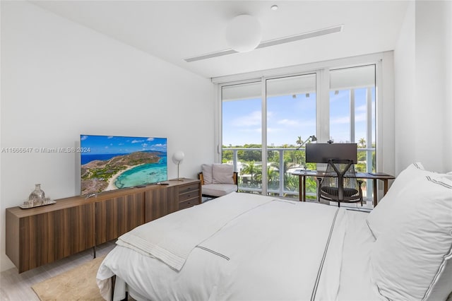 bedroom with light hardwood / wood-style flooring