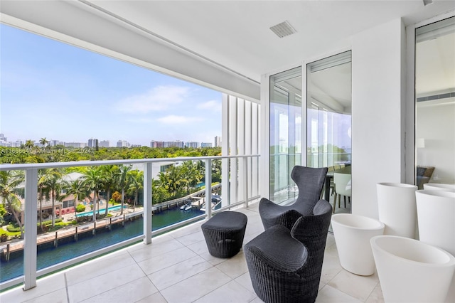 balcony featuring a water view