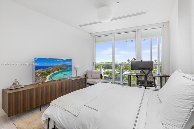 bedroom with light hardwood / wood-style flooring