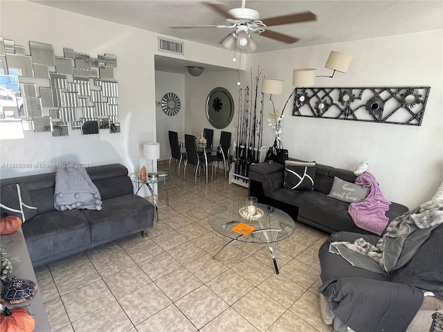 tiled living room with ceiling fan