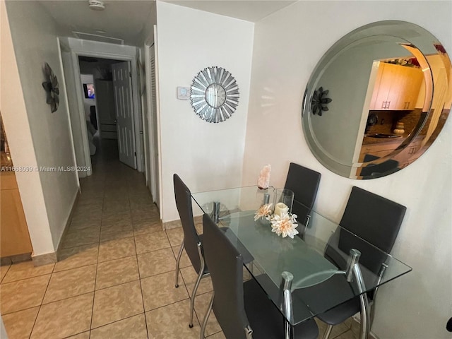 dining space with light tile patterned floors