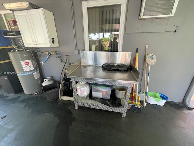 utility room featuring electric water heater