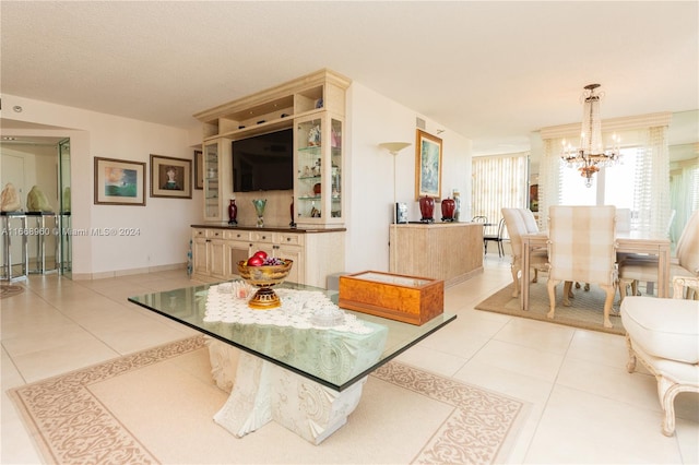 interior space with light tile patterned flooring and a chandelier