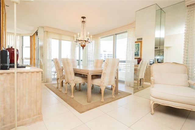 dining space featuring light tile patterned floors and a chandelier