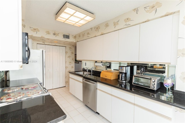 kitchen featuring dishwasher, white cabinetry, and sink