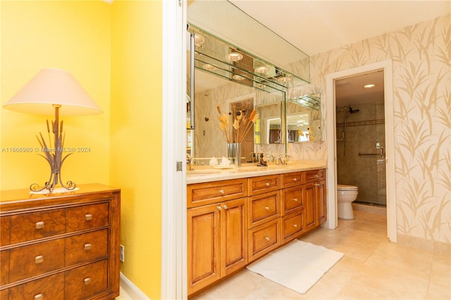 bathroom with tile patterned flooring, a shower with door, toilet, and vanity