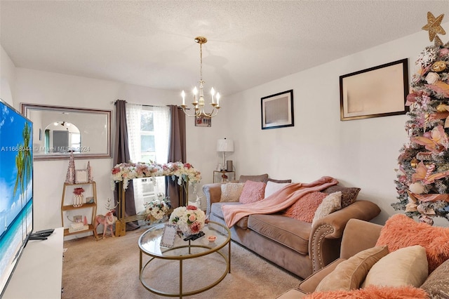 living room with a textured ceiling, light carpet, and a notable chandelier