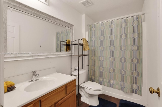 full bathroom featuring wood-type flooring, vanity, toilet, and shower / tub combo with curtain