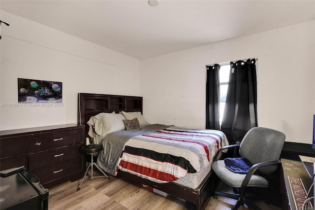 bedroom with light hardwood / wood-style floors