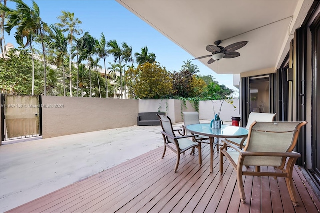 wooden terrace featuring ceiling fan