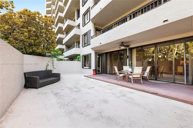 view of patio / terrace with ceiling fan, a balcony, and an outdoor living space