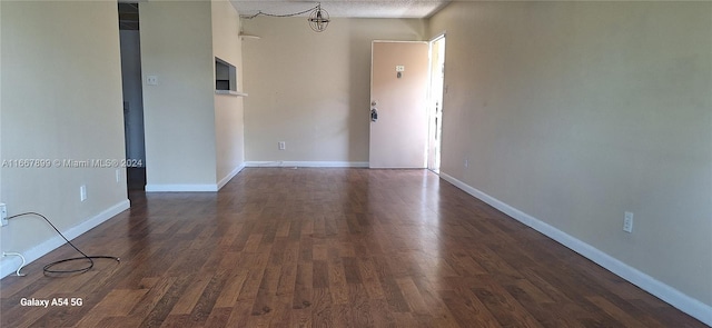 empty room featuring dark hardwood / wood-style floors