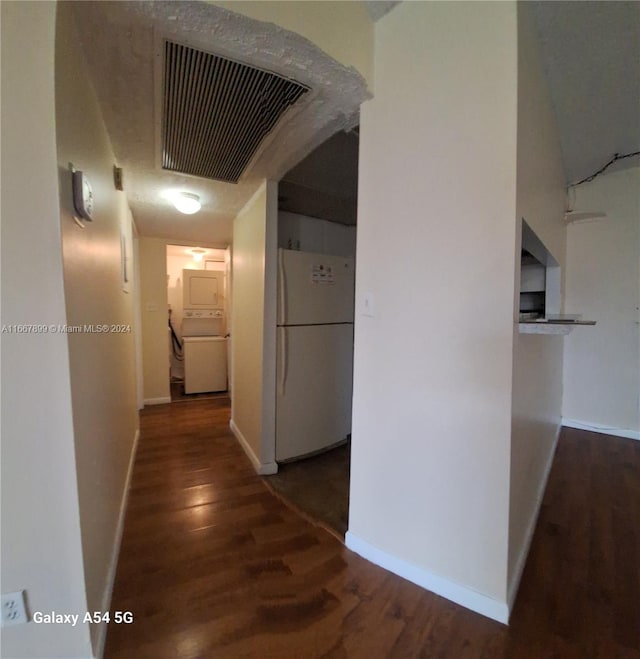 corridor with dark hardwood / wood-style floors