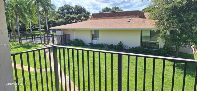 view of side of home featuring a lawn