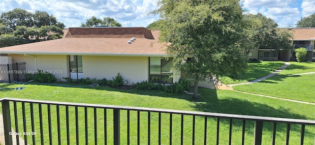 view of home's exterior with a yard