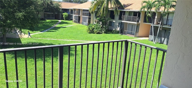 view of yard featuring a balcony