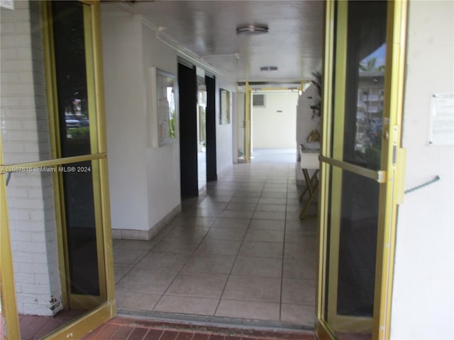 hallway featuring tile patterned floors