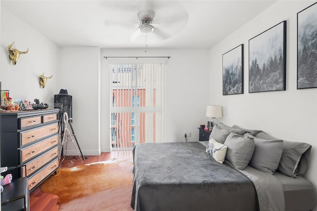 bedroom featuring ceiling fan and dark hardwood / wood-style flooring