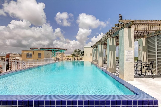 view of pool featuring a patio and a pergola