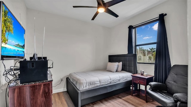 bedroom featuring ceiling fan and hardwood / wood-style flooring