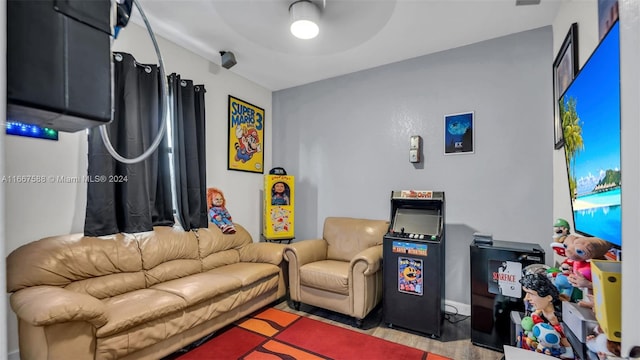 living room with light wood-type flooring and ceiling fan