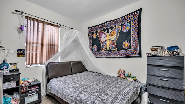 bedroom featuring wood-type flooring