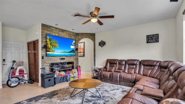 tiled living room featuring ceiling fan