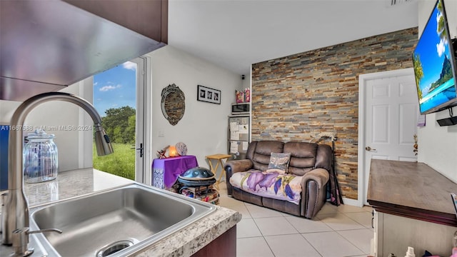 living room featuring light tile patterned flooring and sink