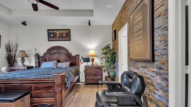 bedroom featuring light hardwood / wood-style floors and ceiling fan