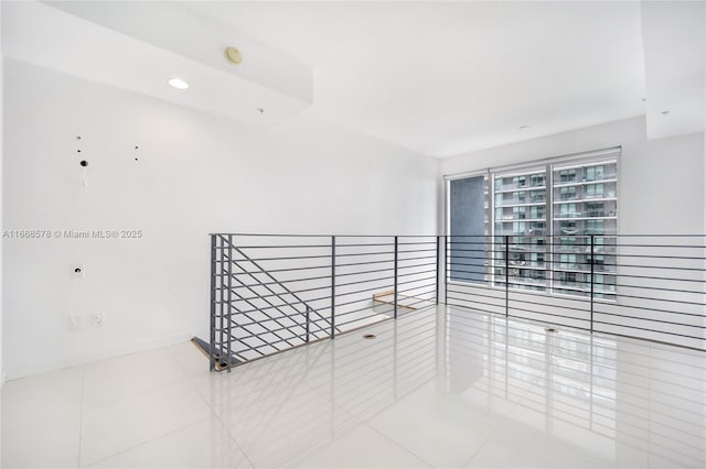 tiled spare room with baseboards