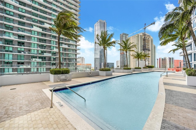 community pool featuring a city view