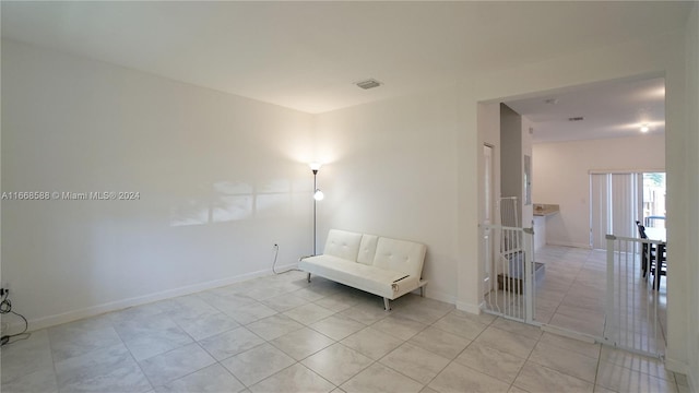 unfurnished room featuring light tile patterned floors