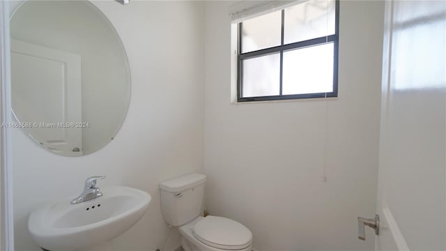 bathroom with sink and toilet