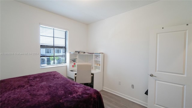 bedroom featuring hardwood / wood-style floors