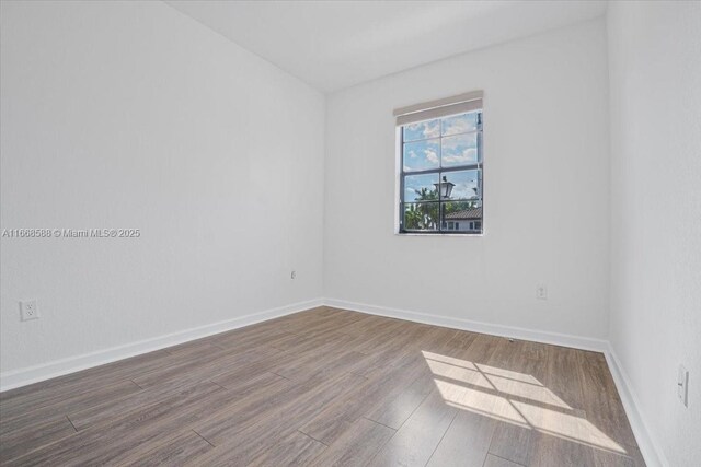 unfurnished office with dark wood-type flooring