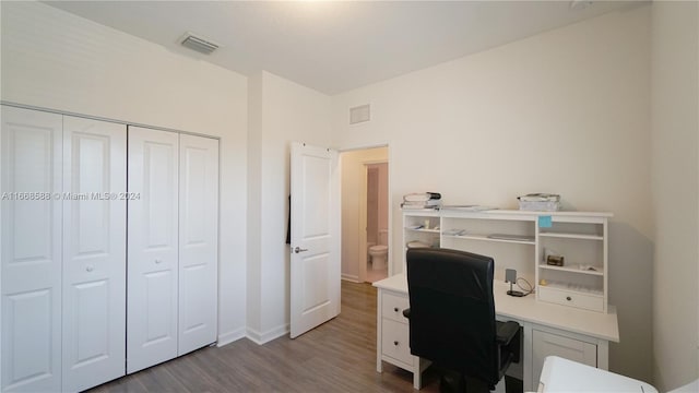 office with light hardwood / wood-style flooring