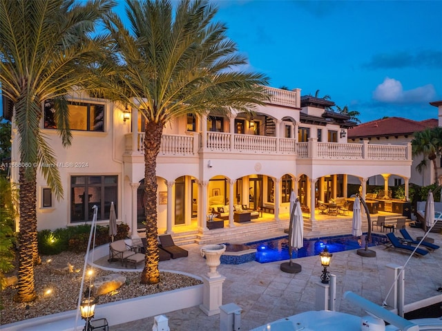 exterior space featuring a patio and a balcony