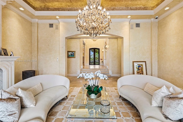 living room with ornamental molding and an inviting chandelier