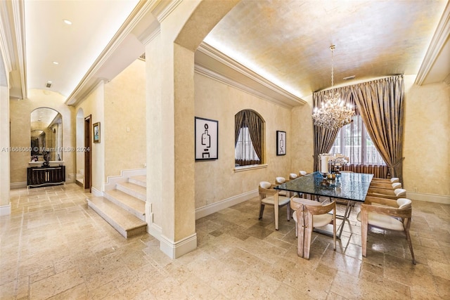 dining room featuring a notable chandelier and ornamental molding