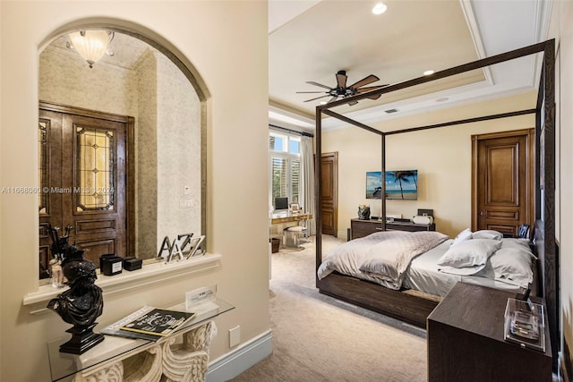 bedroom with ornamental molding, carpet, and ceiling fan