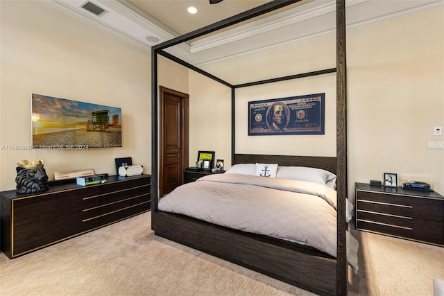 bedroom featuring ornamental molding and light colored carpet