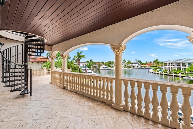 view of patio with a water view