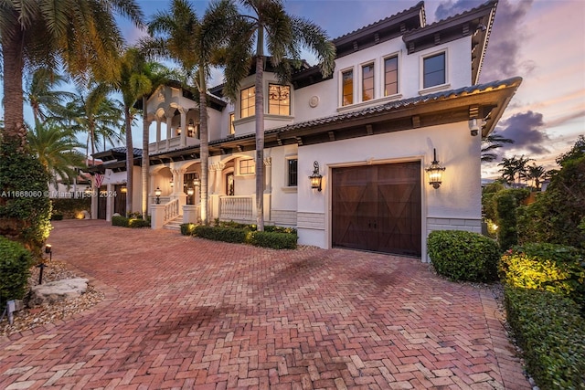 mediterranean / spanish house with a garage