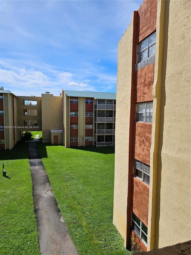 view of community featuring a yard