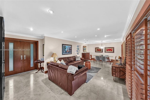 living room featuring an inviting chandelier and ornamental molding