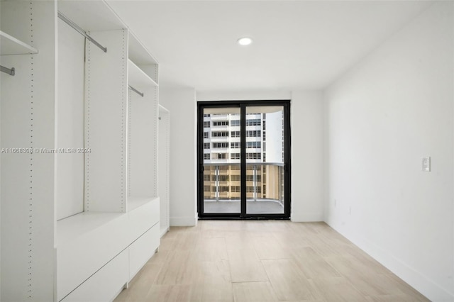 spacious closet featuring light wood-type flooring