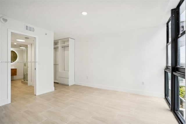 unfurnished bedroom with a closet